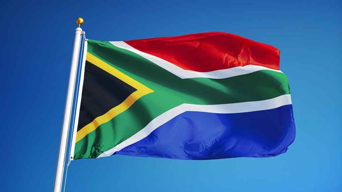 478550506 featured image South African flag waving against blue sky.