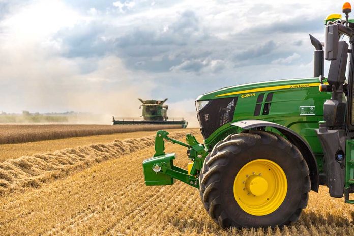 740872495 featured image A green tractor in a wheat field