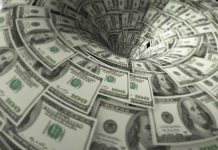 Hundred dollar bills swirling into a financial vortex