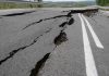 Road damaged by significant cracks and fissures