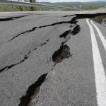 Road damaged by significant cracks and fissures