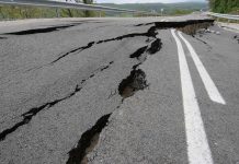 Road damaged by significant cracks and fissures