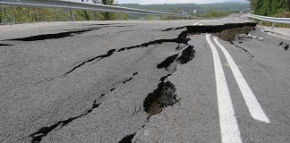 Road damaged by significant cracks and fissures