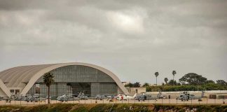 Aircraft hangar with helicopters near the beach