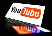 YouTube logo on a laptop and smartphone screen