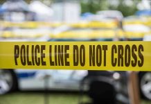 Yellow police line tape with Do Not Cross
