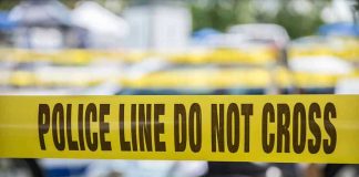 Yellow police line tape with Do Not Cross