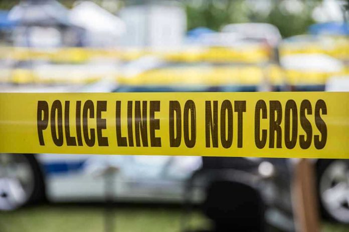 Yellow police line tape with Do Not Cross