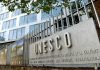 Exterior view of the UNESCO building with a prominent sign