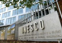 Exterior view of the UNESCO building with a prominent sign