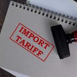 Notebook with Import Tariff stamp and rubber stamper.