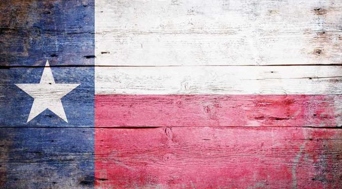 shutterstock_127542200.jpg Texas flag displayed on a wooden background