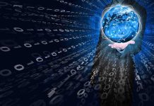 A businessman holding a glowing globe surrounded by binary code