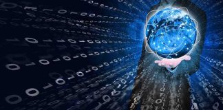 A businessman holding a glowing globe surrounded by binary code