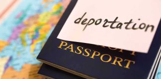Stack of passports with a note labeled 'deportation' on top, placed on a map