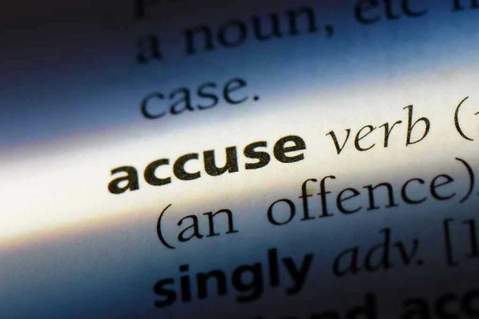 1067759465 Close-up dictionary definition of accuse underlined.