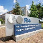 FDA BURIED Deadly Tylenol Warnings for Decades FDA building sign with blue sky background.