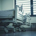 Patient Killed by Roommate – FINALLY BUSTED (again)! Empty hospital beds by a window.