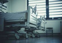 Patient Killed by Roommate – FINALLY BUSTED (again)! Empty hospital beds by a window.