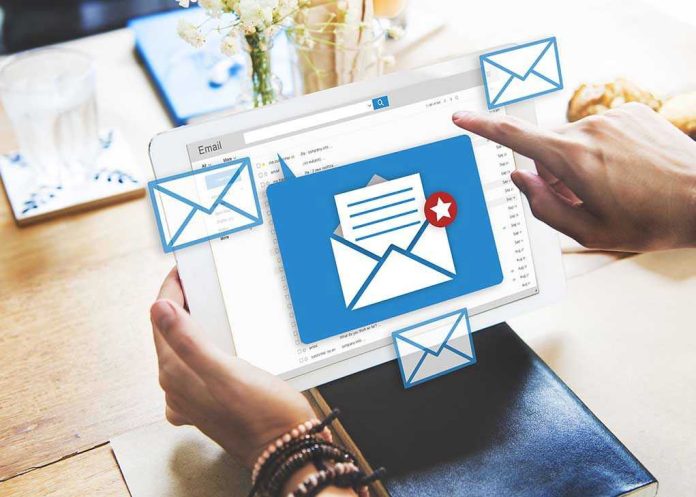 408845122 Tablet displaying email inbox with notifications icon