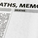Newspaper obituary section with death notices.