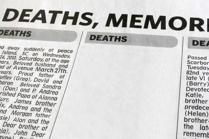 49720510 Newspaper obituary section with death notices.