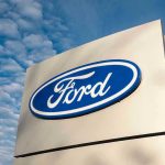 NEW MASSIVE Ford Recall – FAILING Dangerously Ford logo sign against blue sky.