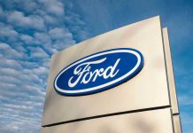 NEW MASSIVE Ford Recall – FAILING Dangerously Ford logo sign against blue sky.