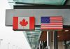 Trump vs. Canada Over FAKE Ad Canadian and American flags displayed at a border crossing