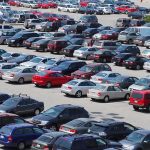 LEAST RELIABE CARS — Shocking 2025 Report A crowded parking lot filled with various cars
