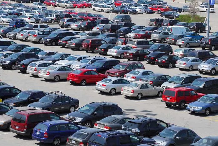 shutterstock_11988958.jpg A crowded parking lot filled with various cars