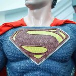 SNAP Lifeline VANISHING—HERO Steps In Close-up of a Superman statue wearing a blue costume and red cape