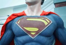 SNAP Lifeline VANISHING—HERO Steps In Close-up of a Superman statue wearing a blue costume and red cape