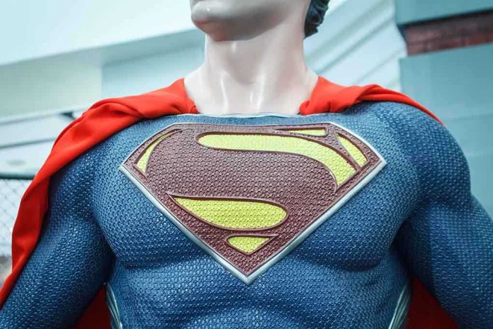 Close-up of a Superman statue wearing a blue costume and red cape