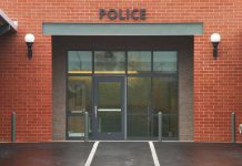 Entrance of a modern police station with brick facade