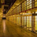 LAST-SECOND Reprieve Stuns Oklahoma — Death Row Shocker Empty hallway between rows of prison cells.