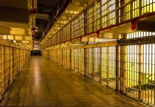 LAST-SECOND Reprieve Stuns Oklahoma — Death Row Shocker Empty hallway between rows of prison cells.