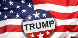 Button with Trump on American flag.