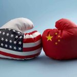 China’s SHOCKING Retaliation Rocks American Economy USA and China boxing gloves facing each other.