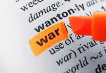 NYC Declares War on Federal Agents Word war highlighted with orange marker in dictionary.