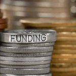 Billionaire’s SHOCKING Admission Sparks Massive Outrage Stack of coins labeled funding with other coins stacks