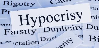 TOP DEMOCRAT SLAMS Pelosi — Hypocrisy Exposed! A collection of paper cards with various negative terms, prominently featuring the word Hypocrisy