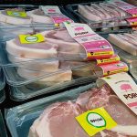 Various packaged pork products displayed in a grocery store