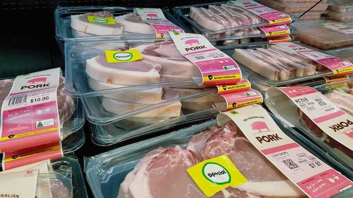 shutterstock_1994278604.jpg Various packaged pork products displayed in a grocery store