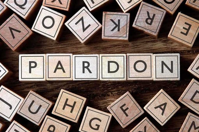 Wooden letter blocks arranged to spell PARDON on a wooden surface