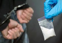 Viral Meth Story FALLS APART Person handcuffed, police holding bag of white substance.