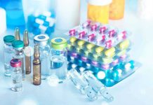 Trump Signals New Phase in Fentanyl War Vials and blister packs of pills on table.