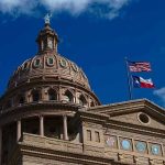 Texas at Risk: Radical Left vs. Traditional Values Building dome with US and Texas flags, blue sky.