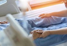 Adult Children’s Monstrous Acts Exposed Hospital patient holding visitors hand reassuringly.