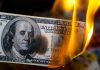 Government Waste: $67 Billion SCANDAL Uncovered Burning hundred-dollar bill with visible flames.